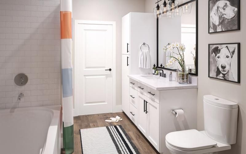 a spacious bathroom with a large mirror and ample light